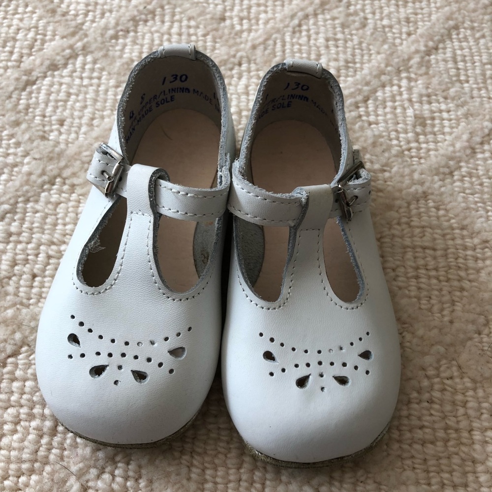 White eyelet shoes